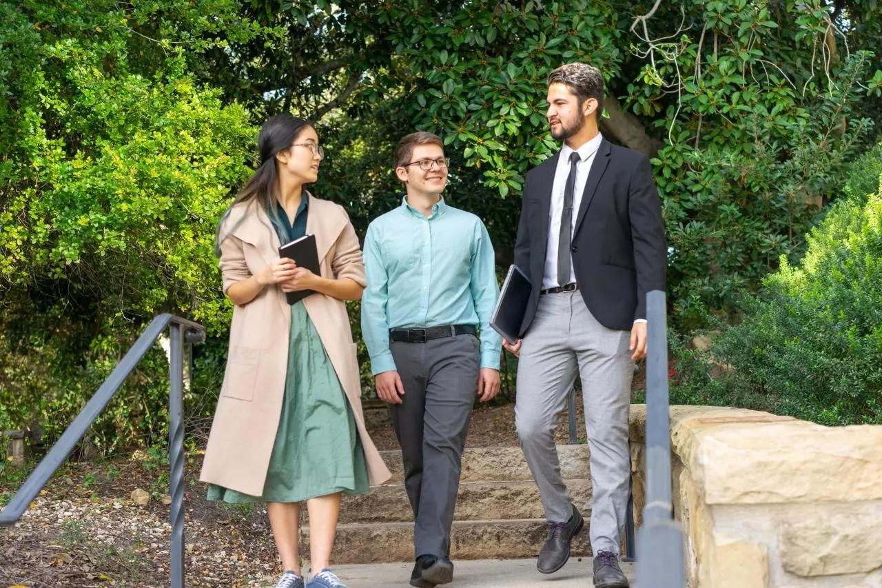 staff walking on campus